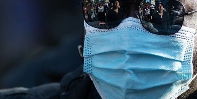 ABD'de günlük Kovid-19 vakaları hızla artarken maske tartışmaları devam ediyor