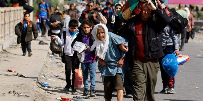 Palestinians fleeing north Gaza move southward, in the central Gaza Strip