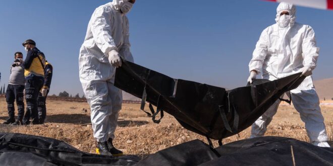 White Helmets recover bodies from mass grave in Damascus containing sacks of human remains